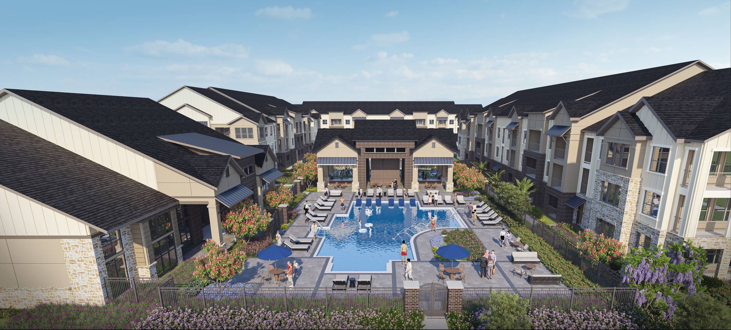 Camber Ridge Apartments aerial view of the pool area surrounded by modern apartment buildings with lush landscaping and outdoor seating areas.