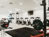 Camber Ridge has a modern gym featuring a minimalist design and high-tech exercise machines