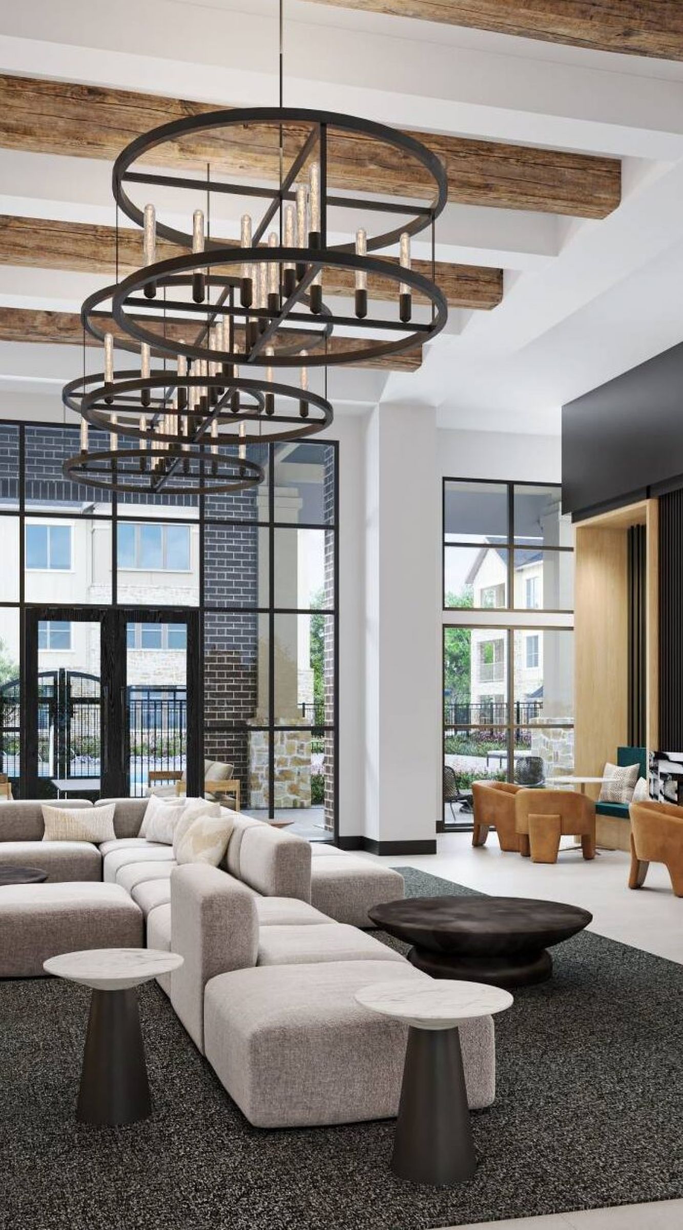 Camber Ridge modern lobby with stylish seating area, wooden beams on the ceiling, and contemporary chandeliers