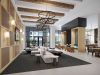 Camber Ridge Apartments modern lobby with stylish seating area, wooden beams on the ceiling, and contemporary chandeliers